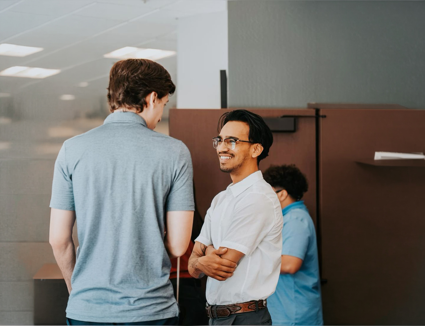 Two colleagues talking and smiling